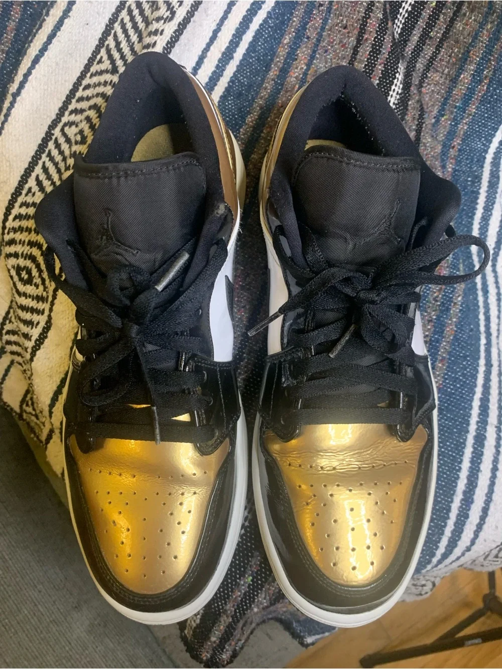 Air Jordan low “Gold Toe” in size 11 men.
